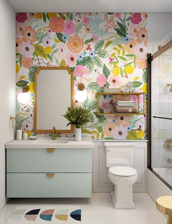 A colorful and light bathroom. The vanity has a round sconce on each side of it, adding to the lighting.
